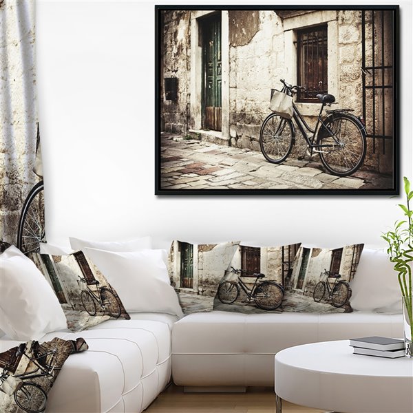 Designart 16-in x 32-in Bicycle with Shopping Bag Canvas Wall Panel with Black Wood Frame