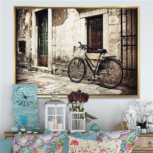 Designart 30-in x 40-in Bicycle with Shopping Bag Canvas Wall Panel with Gold Wood Frame