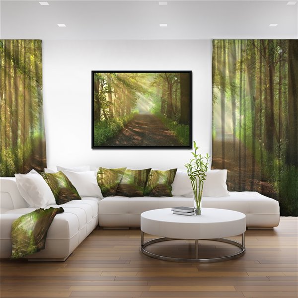 Designart 18-in x 34-in Sun Peeks into Forest with Black Wood Framed Canvas Wall Panel