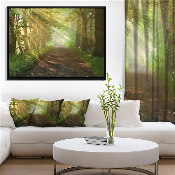 Designart 18-in x 34-in Sun Peeks into Forest with Black Wood Framed Canvas Wall Panel