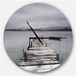 DesignArt 23-in x 23-in Pier and Boats At Seashore Modern Analog Round Wall Clock