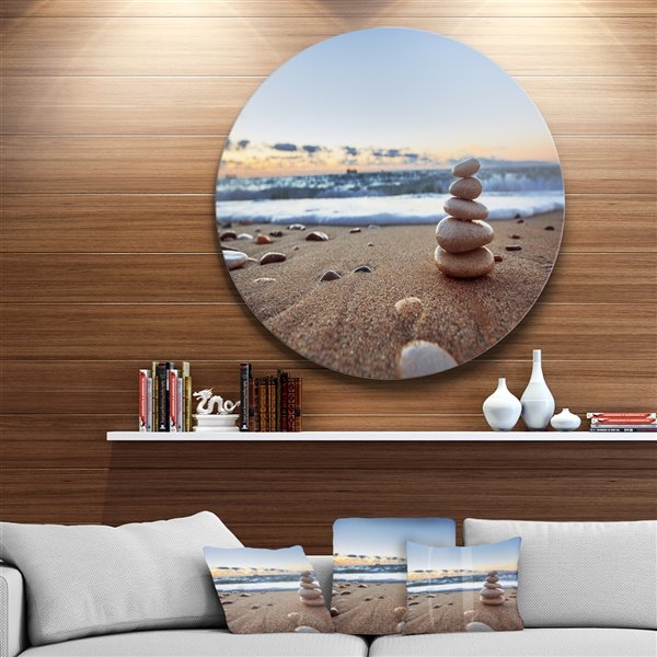 Designart 11-in x 11-in Stones Balance on Sandy Beach Seashore Metal Circle Wall Art