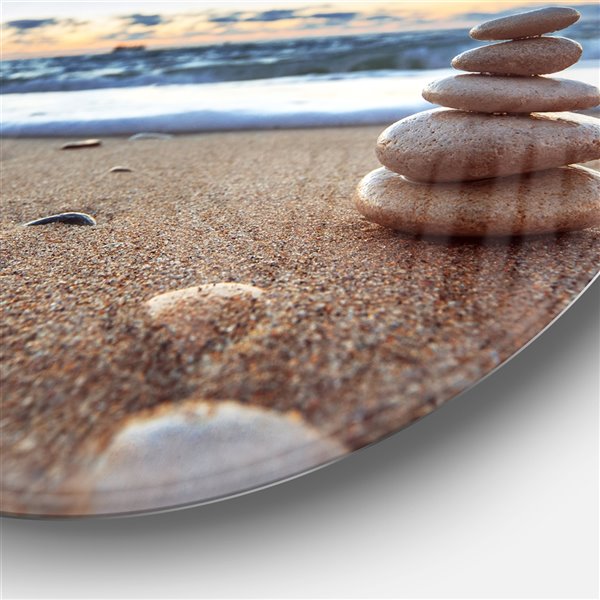 Designart 11-in x 11-in Stones Balance on Sandy Beach Seashore Metal Circle Wall Art