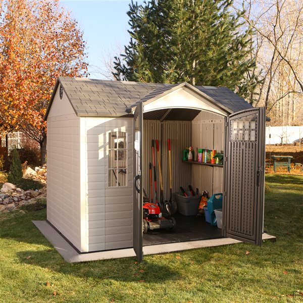 Lifetime 10x8 Outdoor Storage Shed with double doors and gardening tools inside