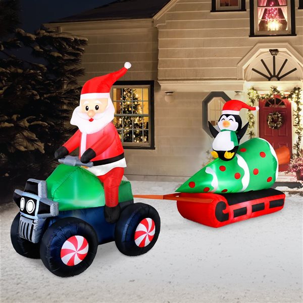 Occasions 12 L x 6-ft H LED Lighted Christmas Inflatable - Santa on ATV Pulling Tree and Penguin