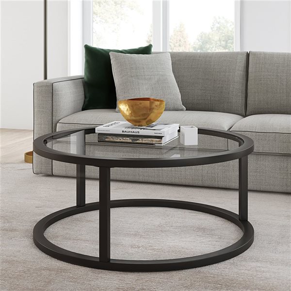 Table basse ronde Parker de Hailey Home noir avec surface en verre