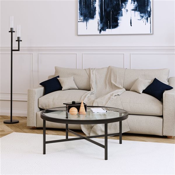 Table basse ronde Xivil de Hailey Home noir avec surface en verre