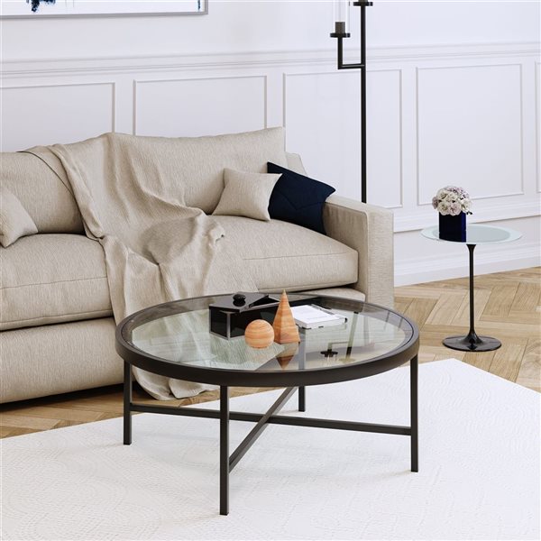 Table basse ronde Xivil de Hailey Home noir avec surface en verre