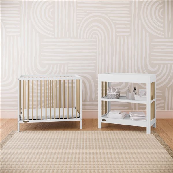Graco Teddi 34-in W White and Light Wood Freestanding Changing Table w/ Water-Resistant Changing Pad